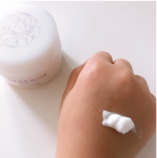 Creamy Japanese anti-aging face cream with applicator, formulated to hydrate and revive skin's youthful radiance.